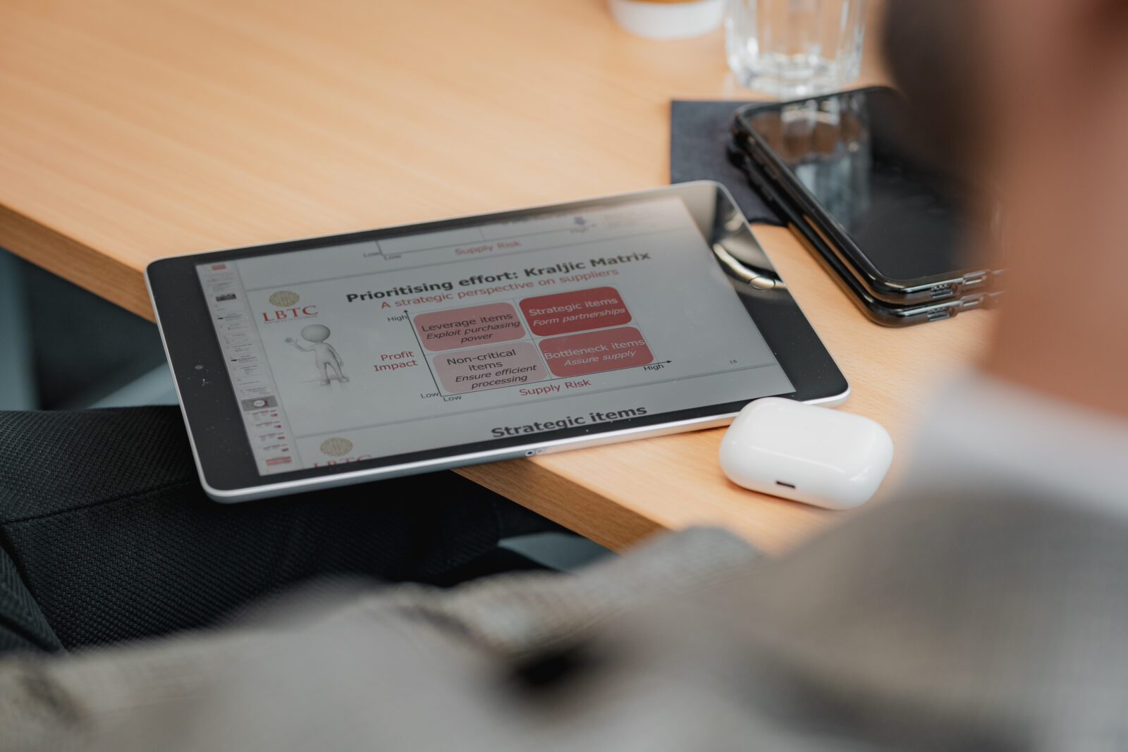 Tablet displaying an LBTC procurement training slide on the Kraljic Matrix supplier prioritisation model